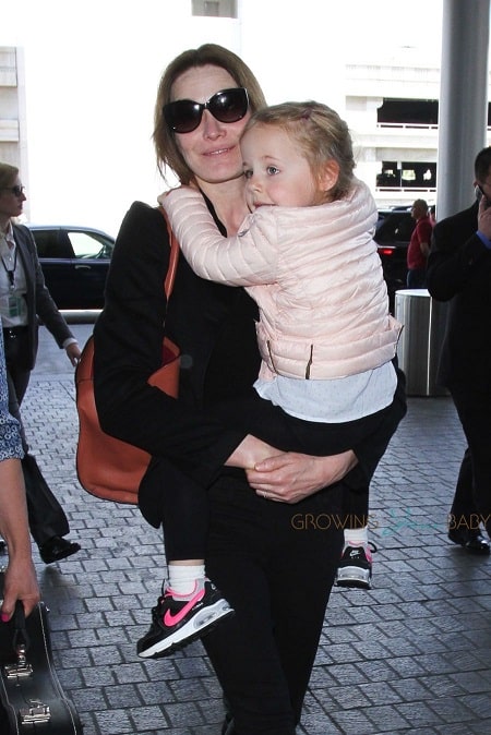 A picture of Carla Bruni carrying Giulia.